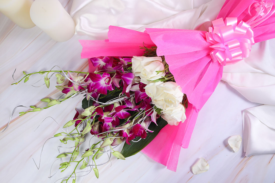 Order Rose and orchid gifting bouquet Online