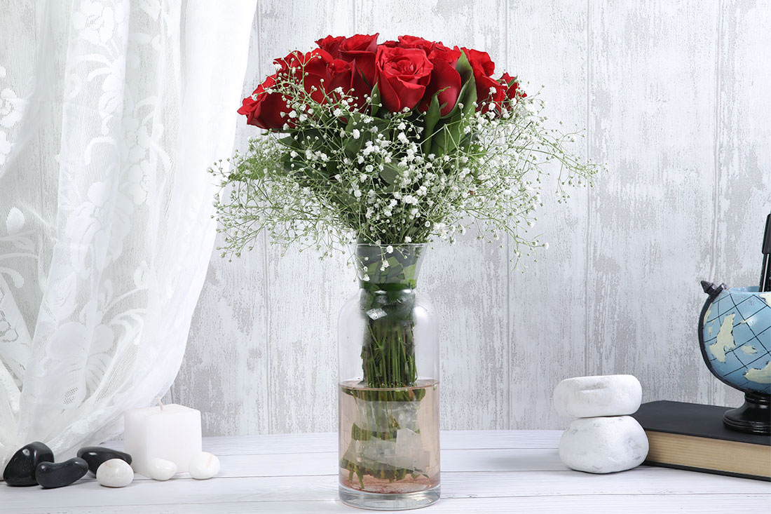 Flower Arrangement of 24 Red Roses in a Glass Vase Online