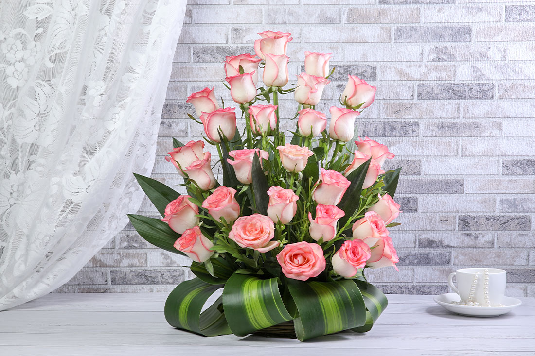 Arrangement of 30 Pink Roses in a Basket