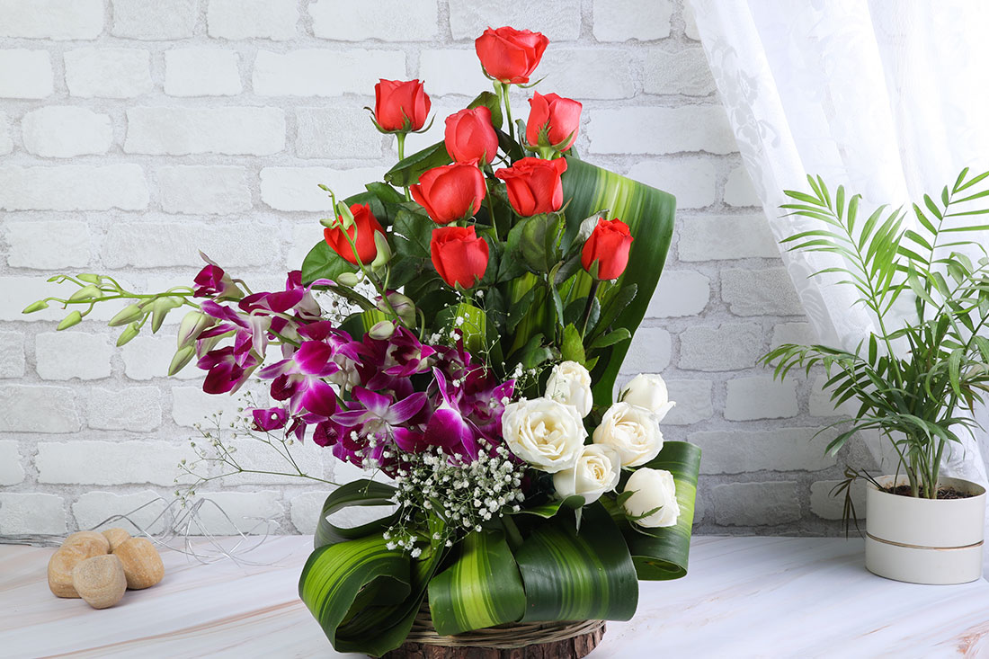 Send 9 Orange Roses, 4 White Roses and 2 Purple Orchids in a Basket Online