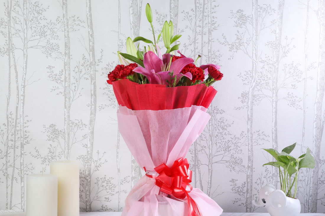 Bunch of 2 Pink Lilies and 6 Red Carnations Order Now
