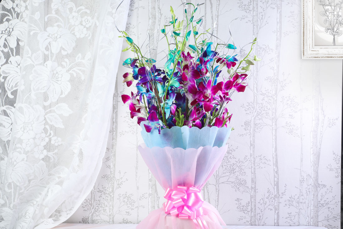 Multi colored orchid bouquet Send Now