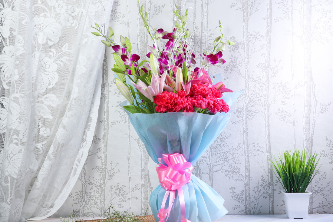 Carnation garland with purple wrappings Order Now