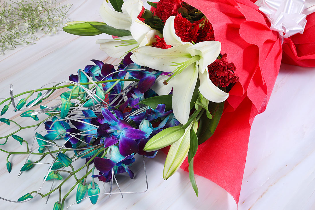 Flower Bouquet of 6 Red Carnations, 4 Blue Orchids, and 2 White Astatic Lilies