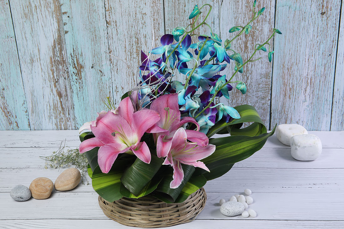 Flower Basket of 5 Blue Orchids & 3 Pink Lilies Online Buy Online