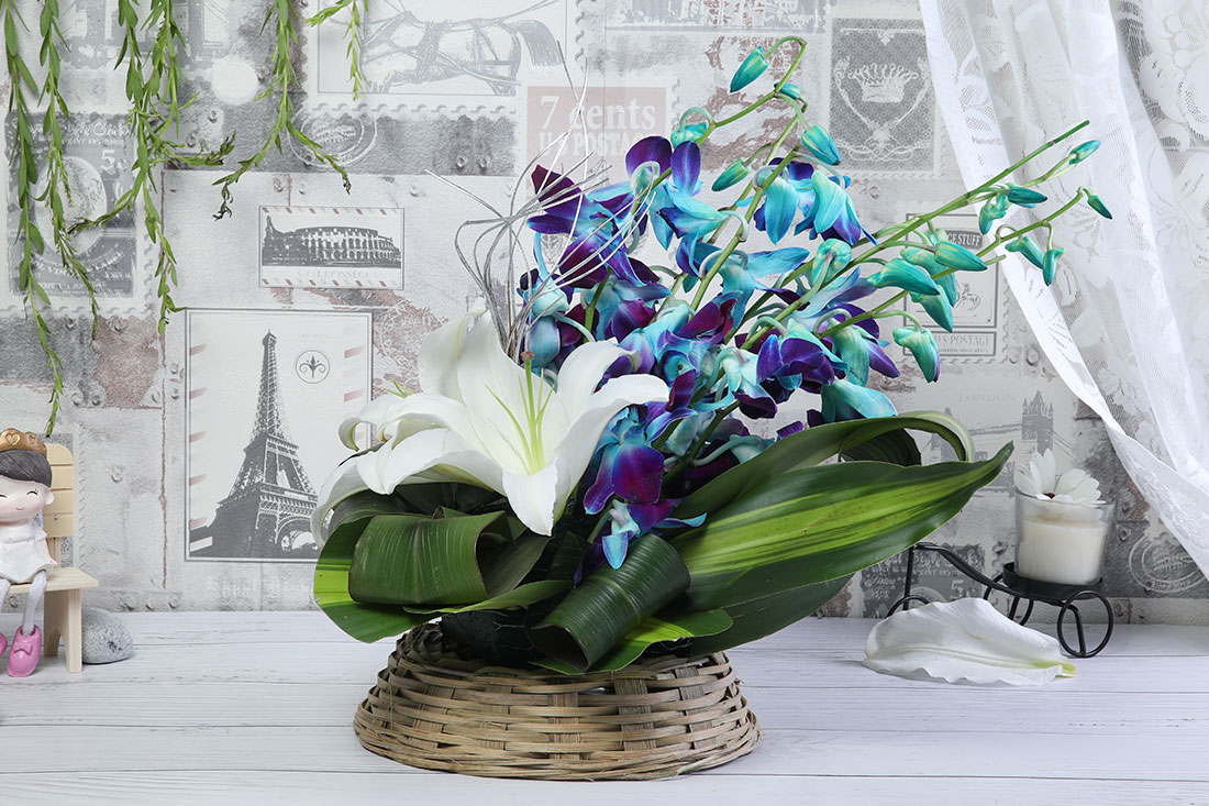Flower Baskets of 5 Blue Orchids and 1 White Ethatic Lilies Send Now