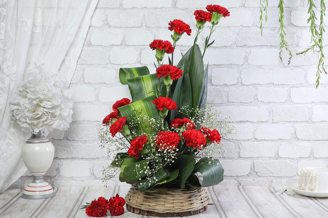 The Royal Rose Bouquet - 15 Red Carnations in a Basket Buy Online
