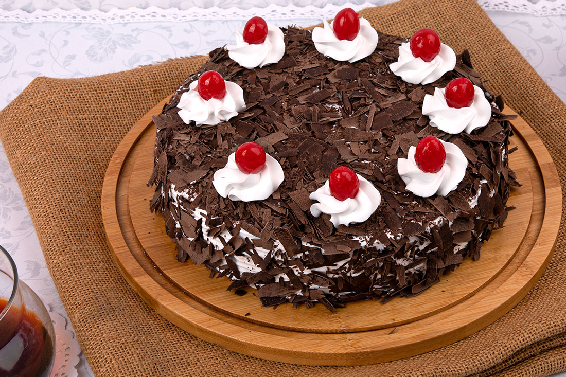 Black Forest Cake With White Cream Toppings