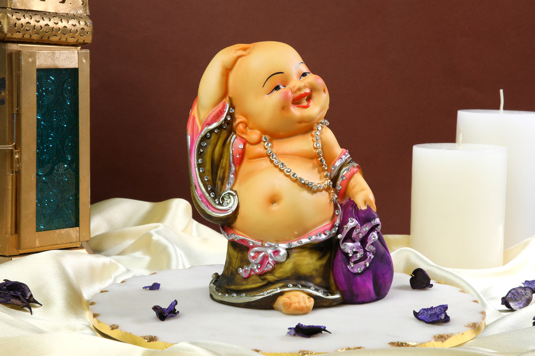 Laughing baby buddha figurine