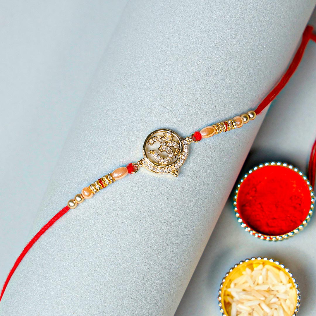 Beautiful Diamond Om Rakhi Send Now