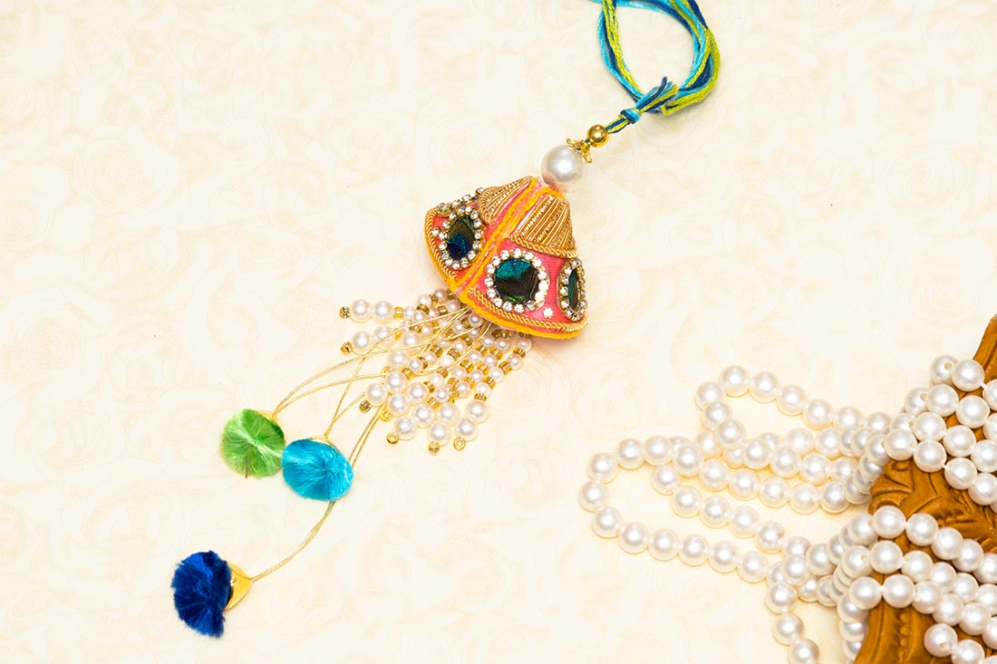 Adorable shimmery rakhi Order Now