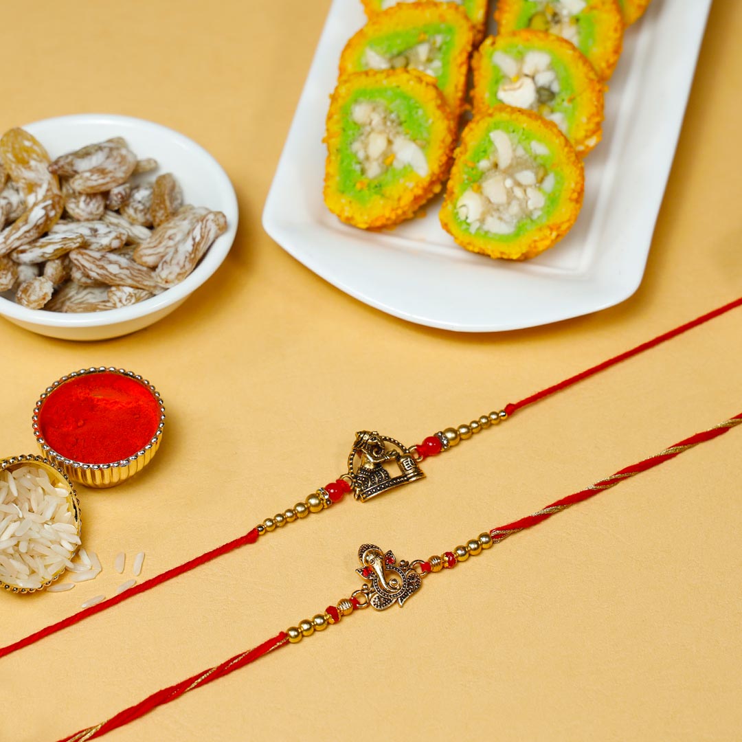 Blessed Ganesha Rakhi Set With Pista Barfi