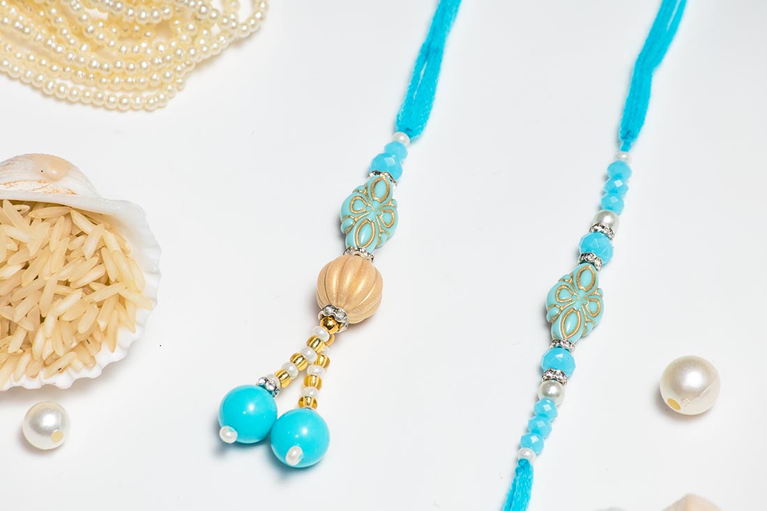 Send Blue rakhi with beads