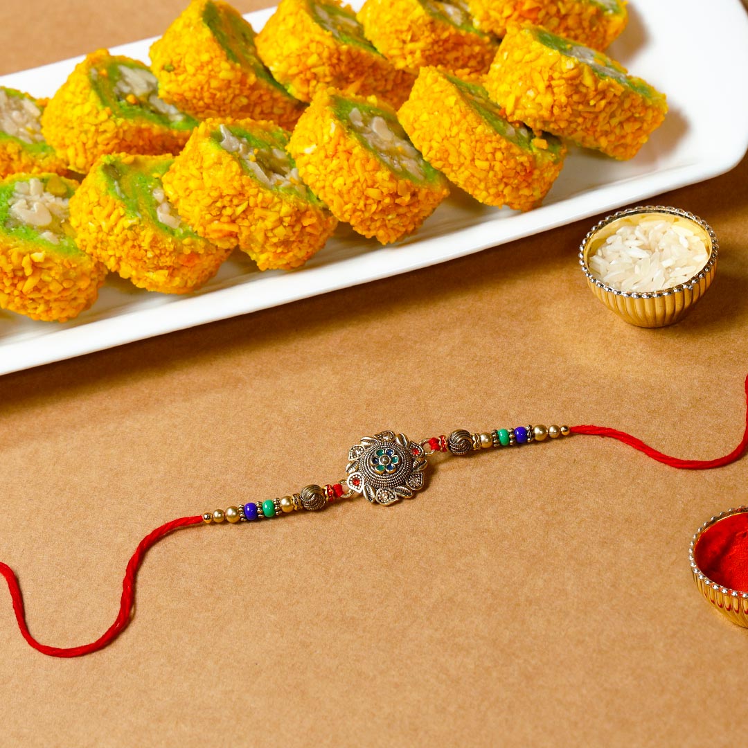 Designer Encarved Metal Rakhi & Pista Barfi