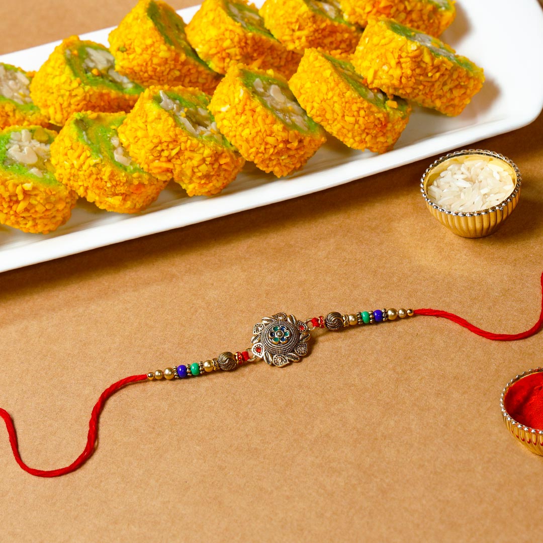 Order Designer Encarved Metal Rakhi & Pista Barfi Online