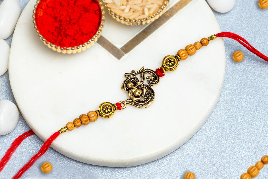 Send Designer om rakhi Online