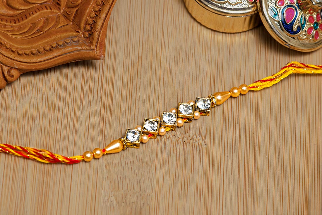 Diamond floral rakhi