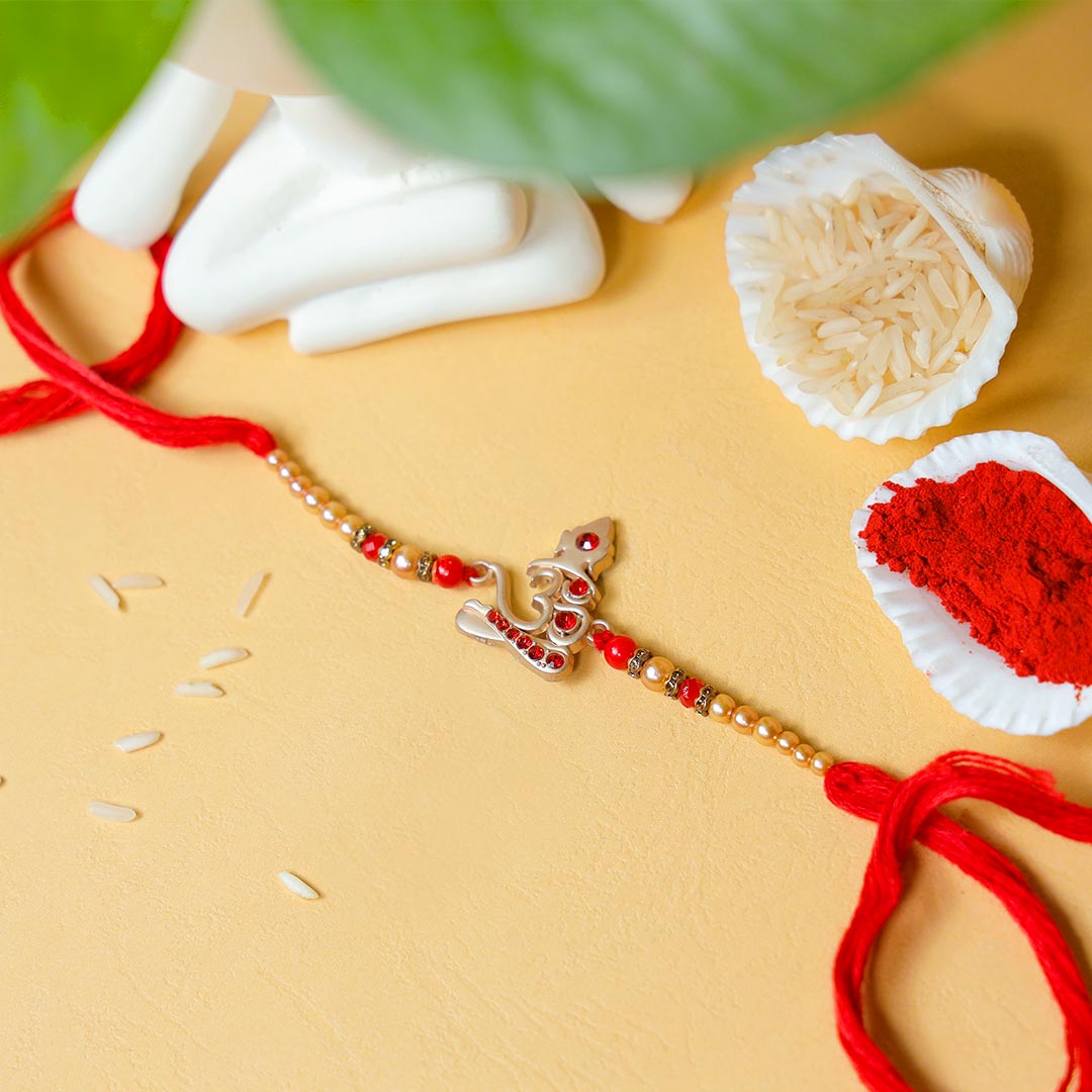 Elegant Om Rakhi With Money Plant