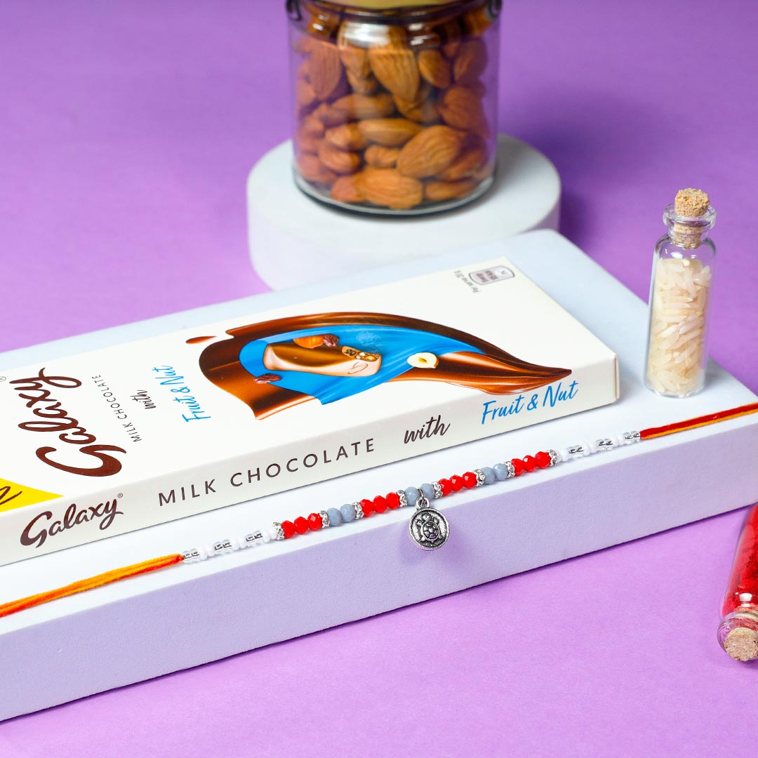 Buy Elegant Ornament Rakhi With Milk Chocolate & Almonds