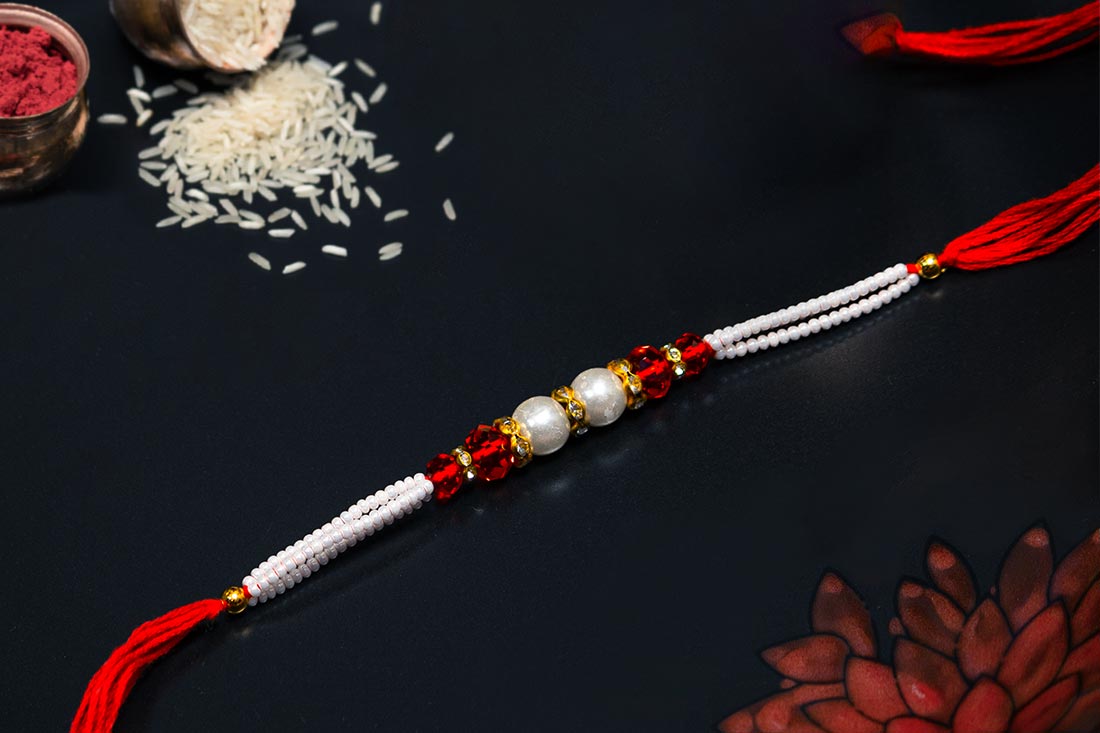 Embedded pearl rakhi