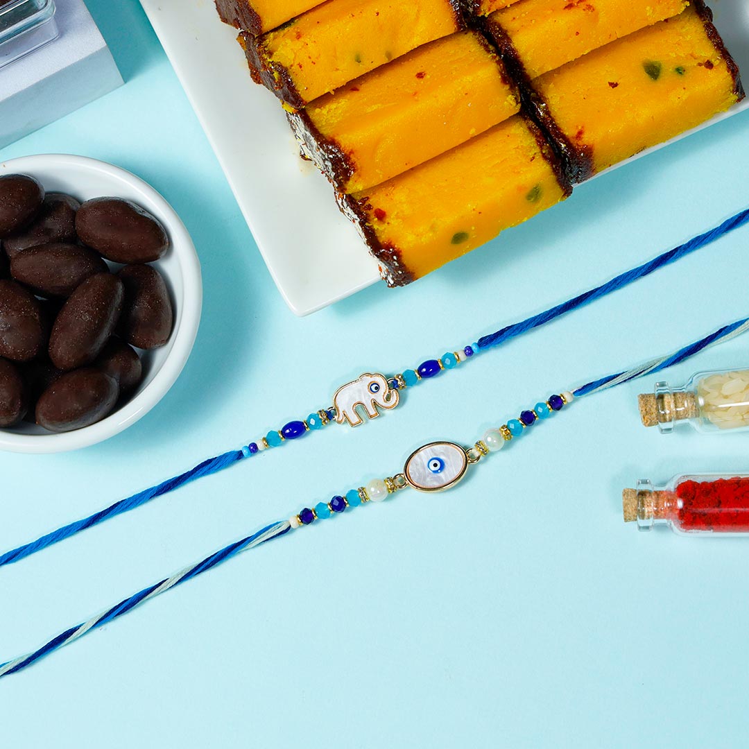 Fancy Evil Eye Rakhis With Semolina Cakes