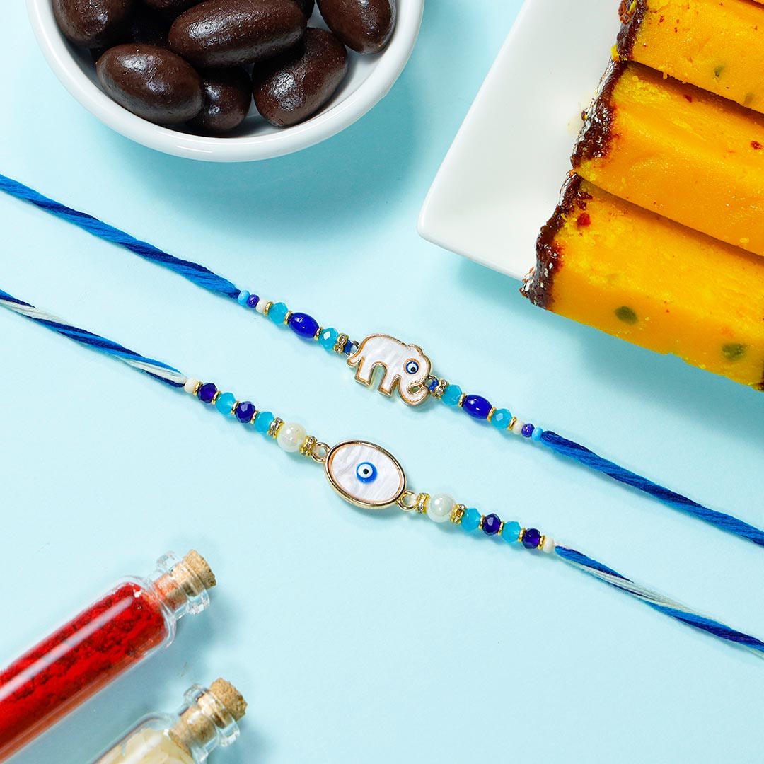 Fancy Evil Eye Rakhis With Semolina Cakes