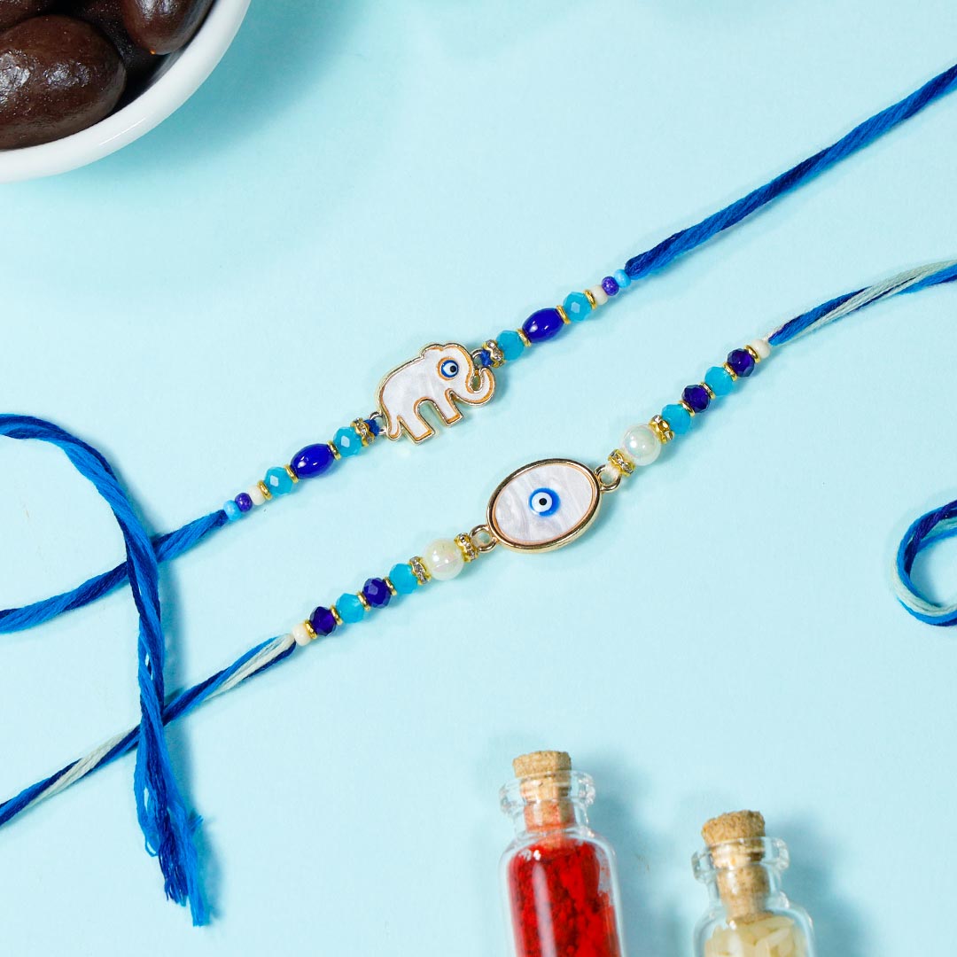 Fancy Evil Eye Rakhis With Semolina Cakes