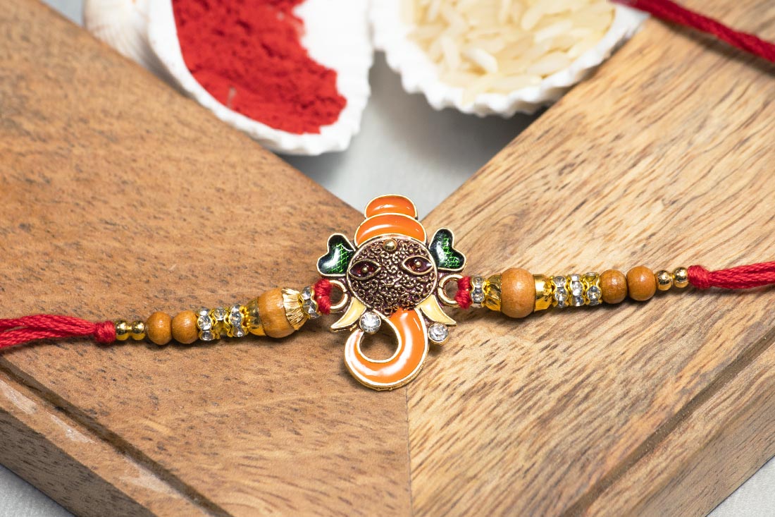 Ganesha brass rakhi Send Now
