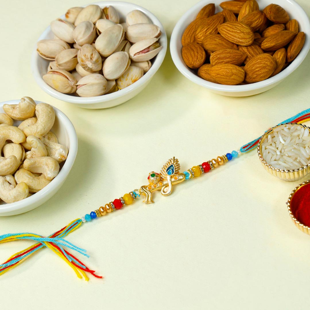 Send Golden Divine Rakhi With Dry Fruits