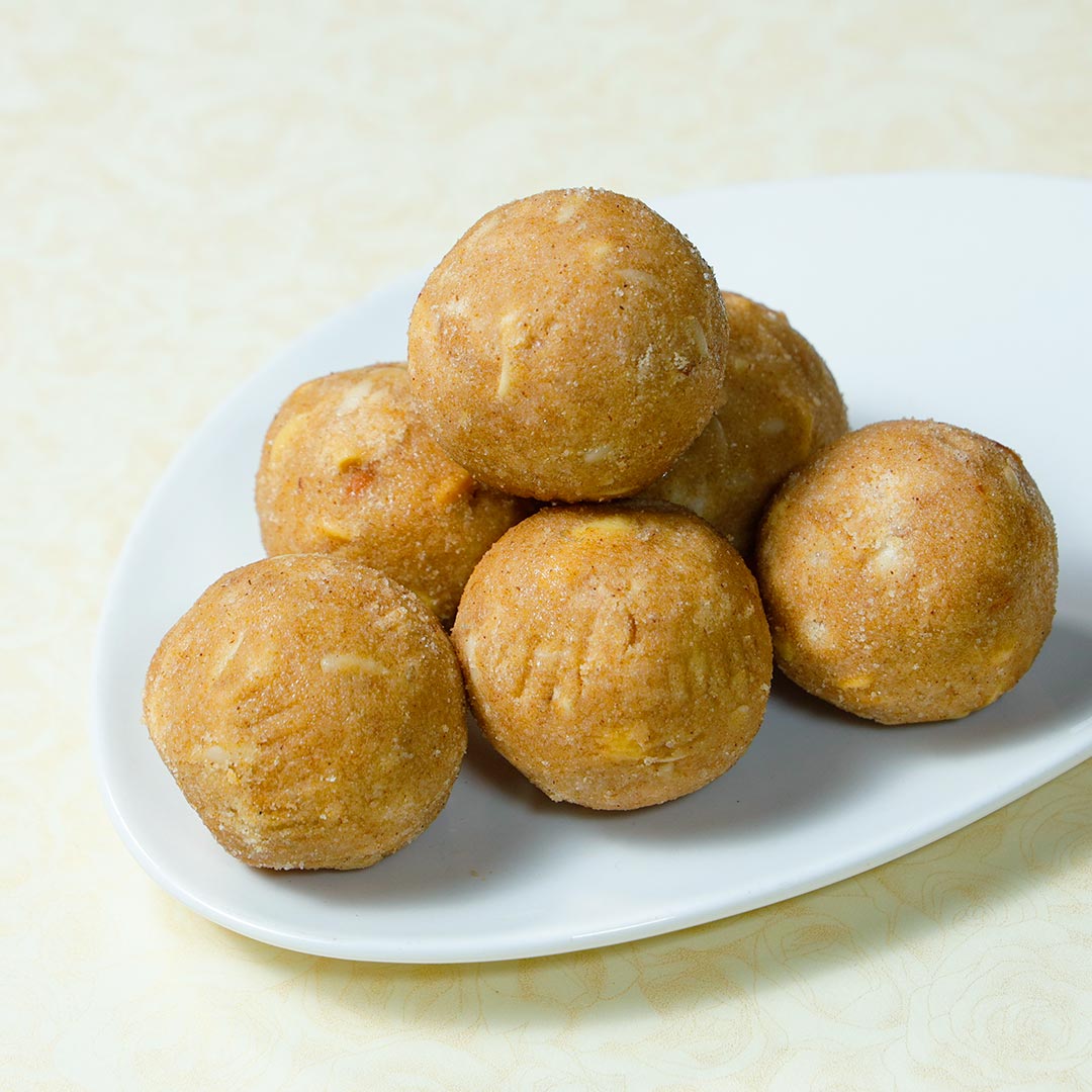 Golden Ganesh Rakhi With Panjiri Laddoo N Almond Dragees