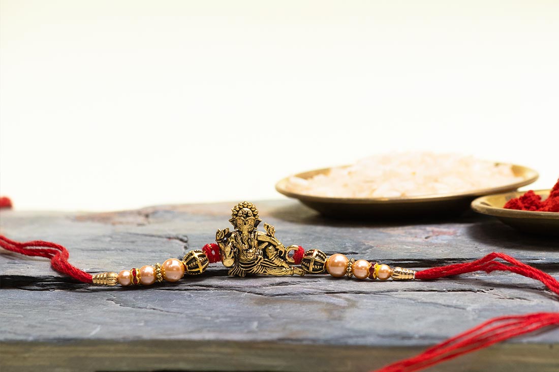 Golden Ganesha Rakhi With Hershey