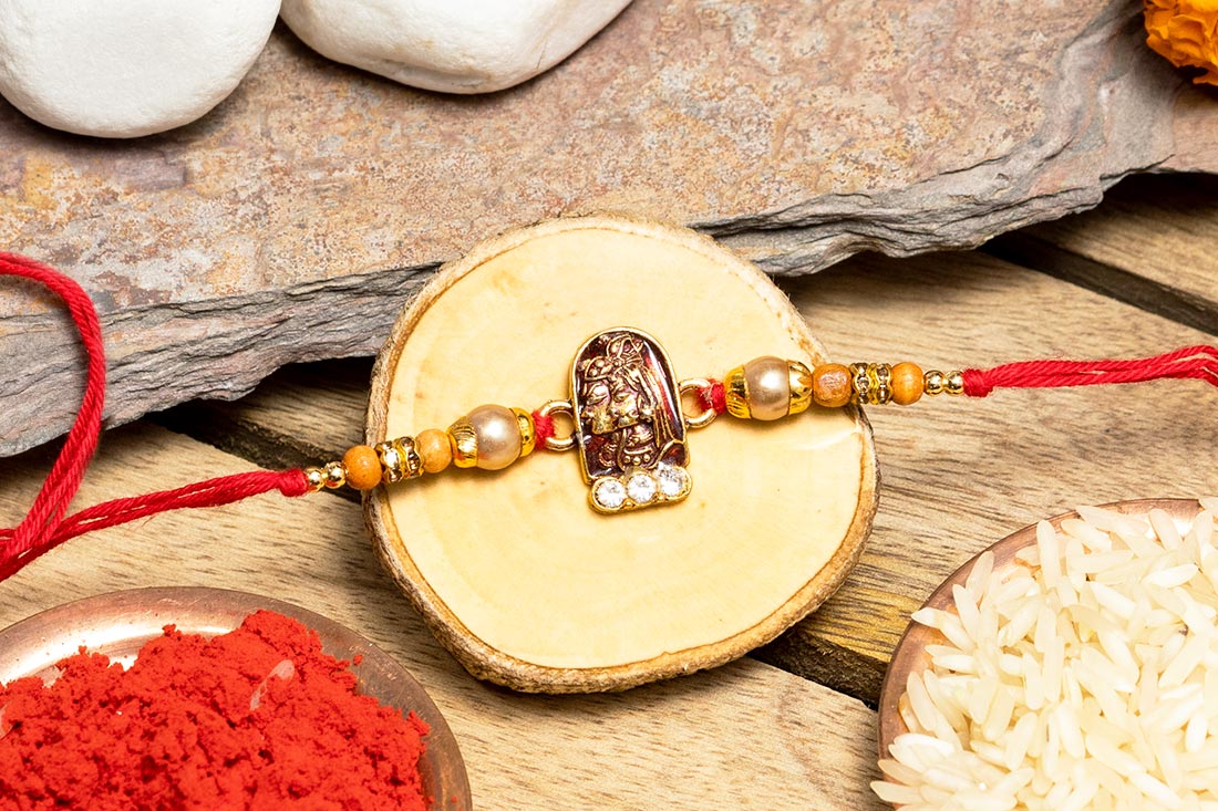 Send Golden krishna rakhi Online