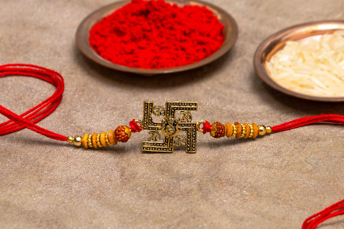 Golden swastik rakhi Buy Online