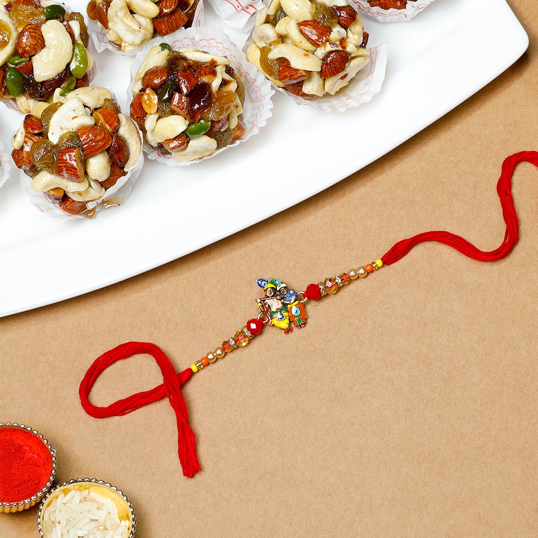 Lovely Radha Krishana Rakhi With Dry Fruit Ladoo Send Now