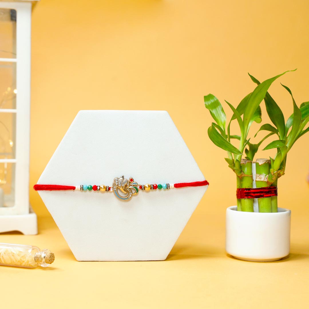 Order Om Rakhi With Lucky Bamboo