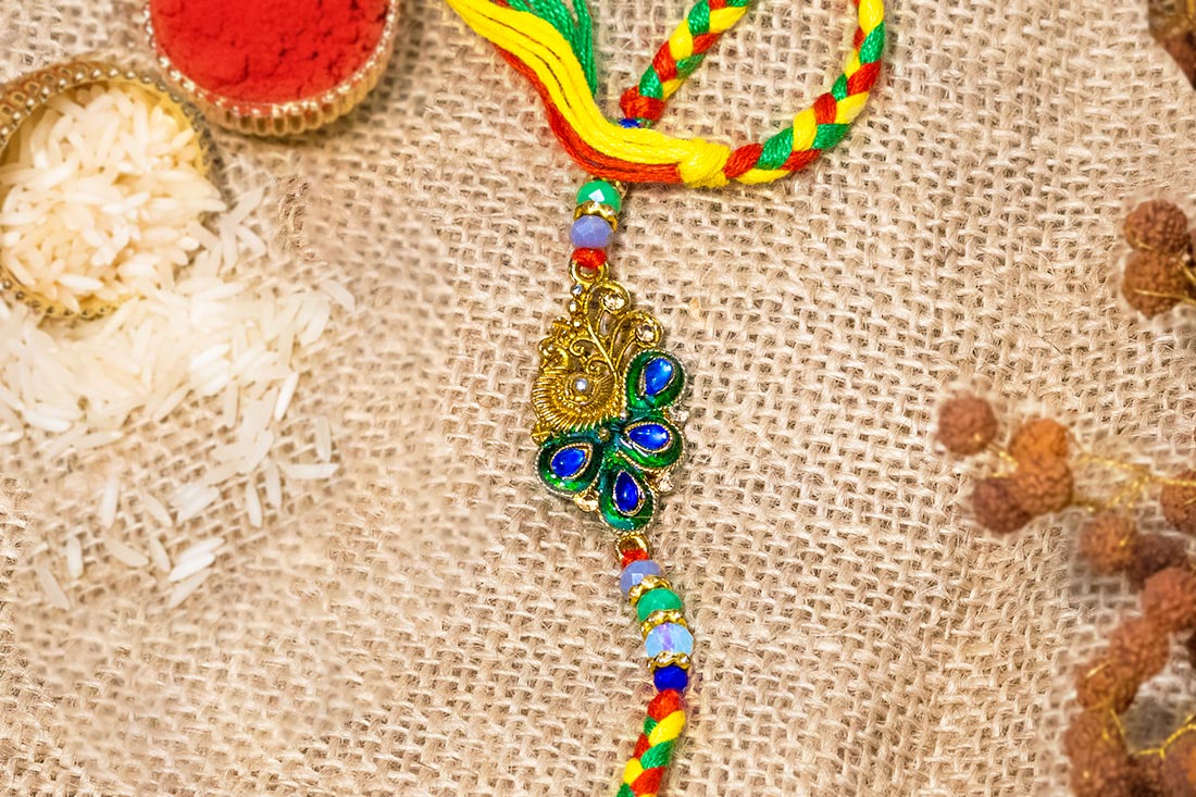 Peacock feather flattering rakhi