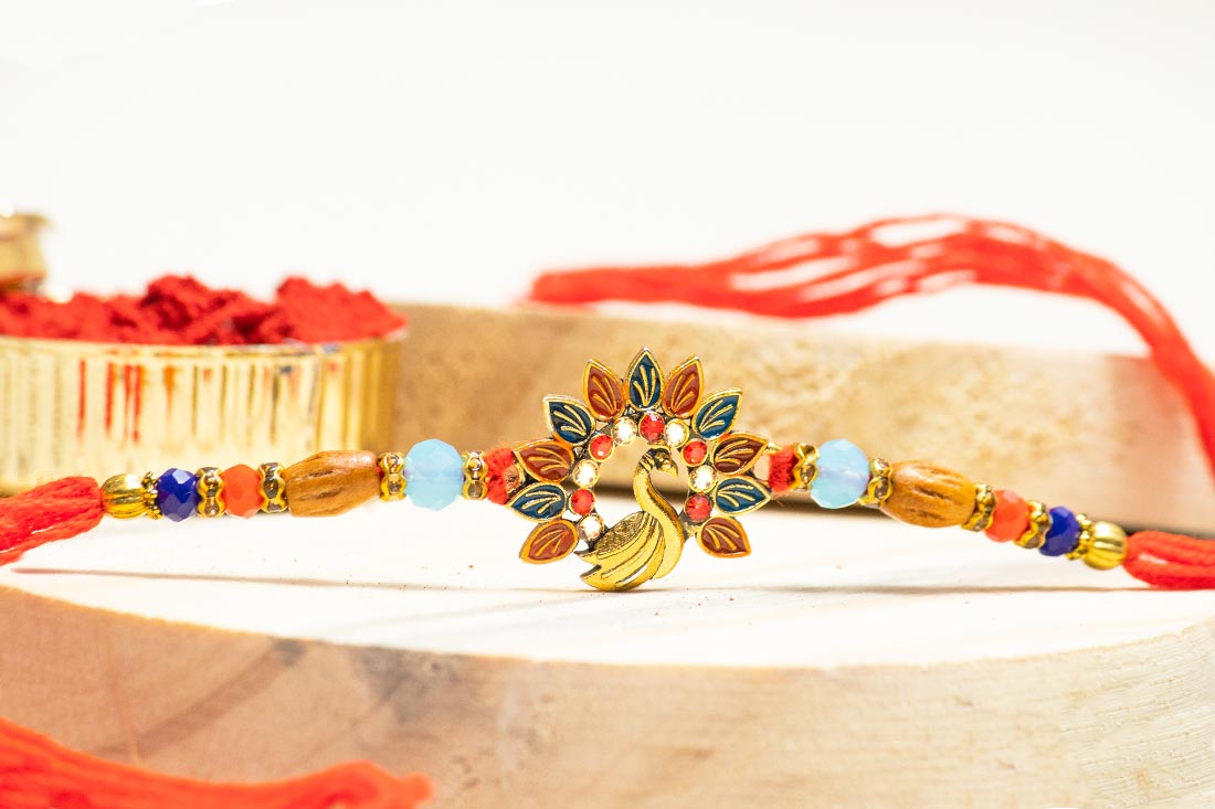 Buy Peacock with pretty feathers rakhi Online