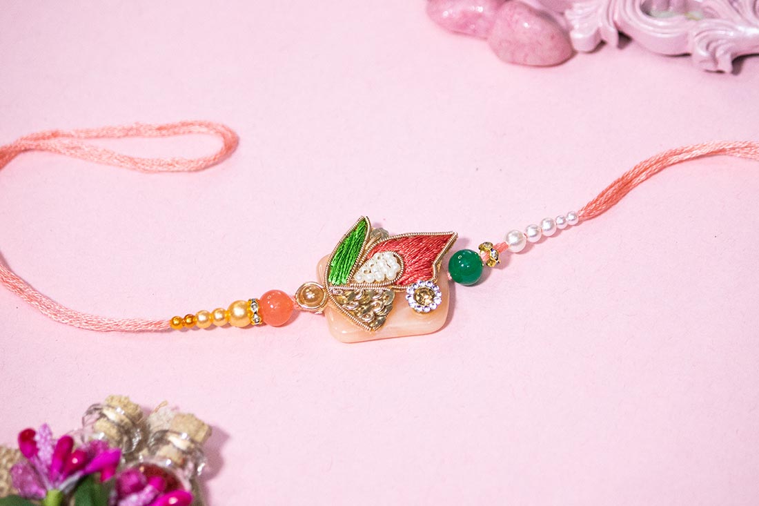 Pink stone studded rakhi