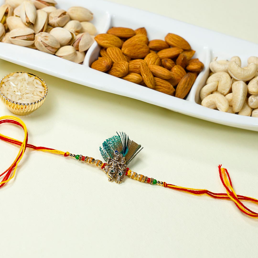 Order Radha-Krishna Feather Rakhi With Dry Fruits
