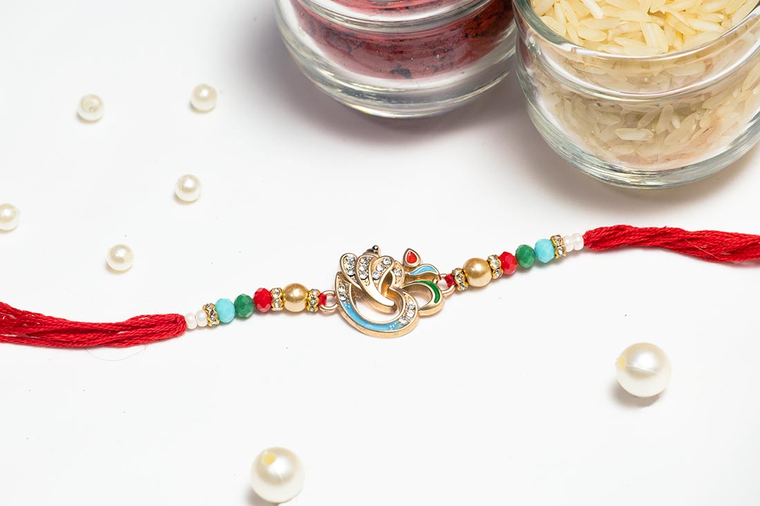 Silver Embellished Om Rakhi