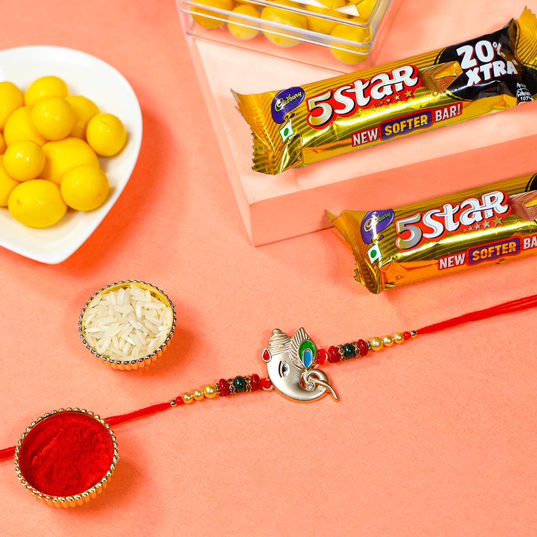 Silver Ganesha Rakhi With 5- star & Dragees Order Now