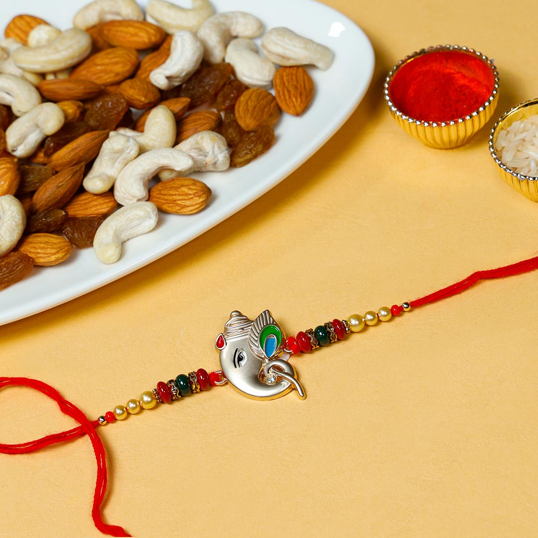 Silver Ganesha Rakhi With Assorted Dry Fruits Send Now