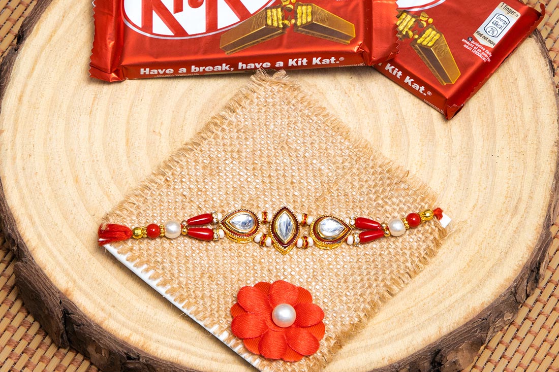Silver Stones Embellished Rakhi With Kitkat Duo