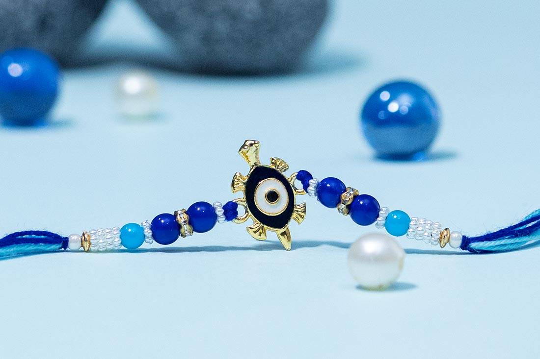 Tortoise rakhi with evil eye bracelets