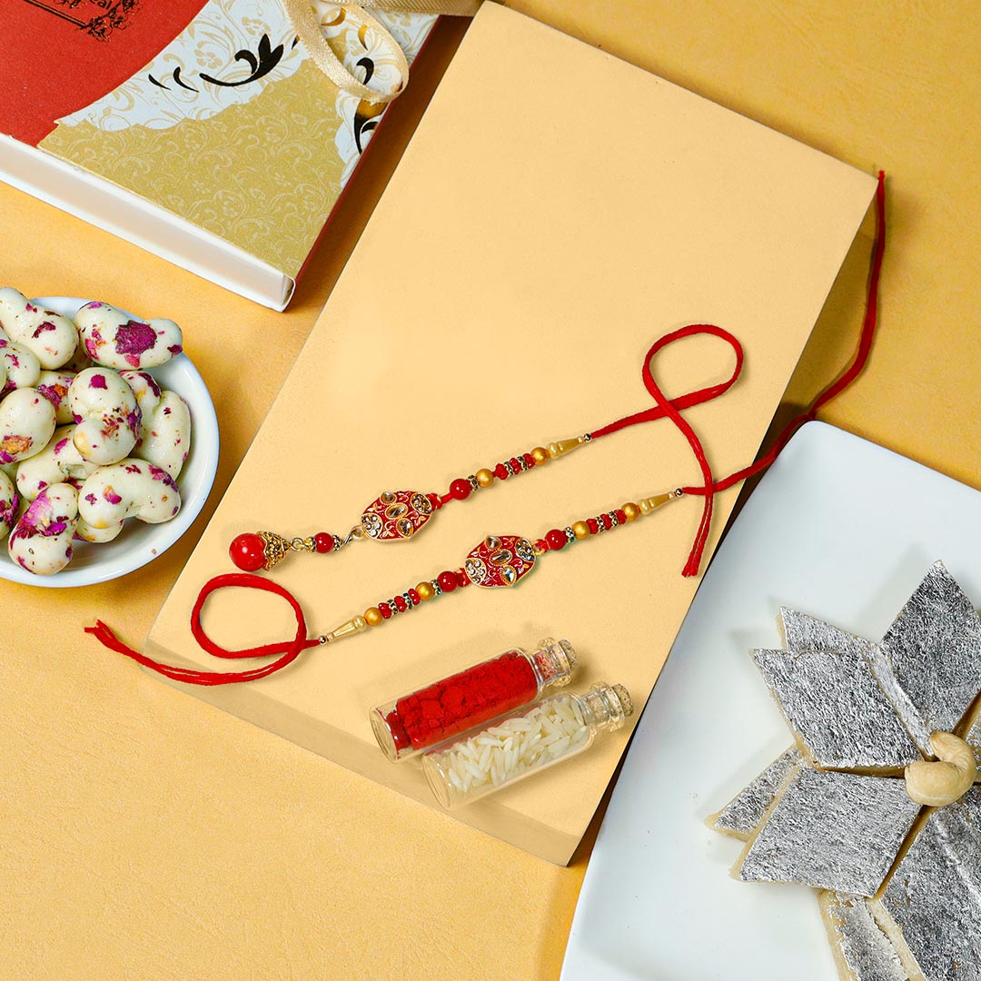 Buy Zardoshi Couple Rakhi With Kaju Katli N Malai Dragees